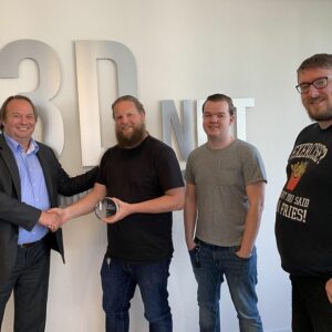 i3D.net accepting Juniper award in front of i3D.net logo